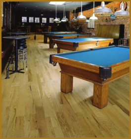 Pool hall showcasing a beautiful hardwood floor